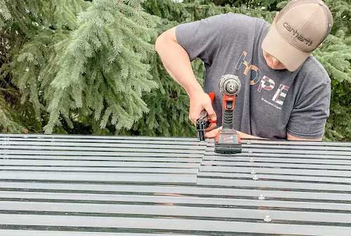 Fiberglass roof panels being installed